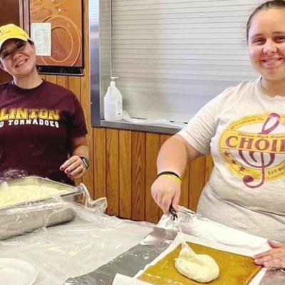 Rolling out the pumpkin rolls