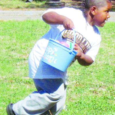 Khalil Douglas grabs an egg, before running to another at Eastside Academy. CDN | Christian Jacobsen