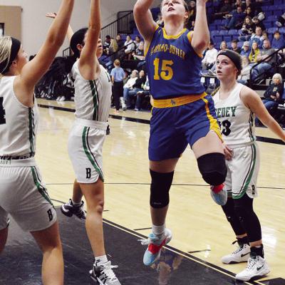 Katie Edelen draws the attention of three Leedey defenders in the opening round of the Five-County Tournament. CDN | Staff photo A-B teams take third in tourney