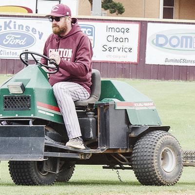 Micheal Deatherage rides the three-wheeler after smoothing the infield dirt prior to Clinton’s baseball home game against Kingfisher. CDN | Sam Goodwyn