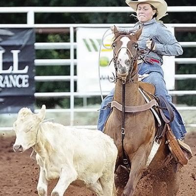 Rebekah Davis ropes a calf during last year’s Clinton Rodeo at the Clinton Round-Up Club Arena. CDN | Sam Goodwyn