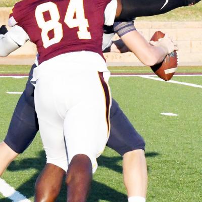 Clinton’s Montiel “Bumpy” Crane targets the Kingfisher quarterback for a strip-sack during last season’s home opener. The Red Tornadoes’ front seven will be a part of the team’s strengths again this year. CDN | John Kinsey Red Tornado defense seeks to be stingy