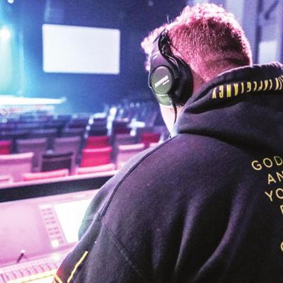 Edge Church Worship Leader Jeremiah Calzada works at the audio, video controls inside of the church’s new facility located at Jaycee Lane Shopping Center. Most local churches waiting to reopen