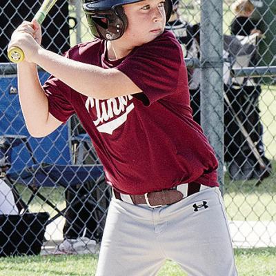 Layton Richmond focuses on the ball during his at-bat during Clinton’s baseball game in the OK Kids 8U Baseball State Tournament at Schumacher Fields at Acme Brick Park. CDN |Sam Goodwyn