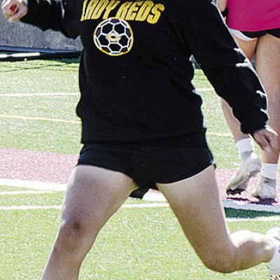 Savanah Martinez goes to kick the ball during practice in the Tornado Bowl. CDN | Sam Goodwyn