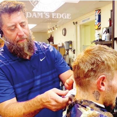 Adam Cisneros has been a barber since he was 15