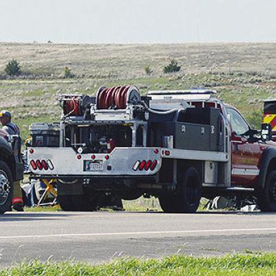 Emergency responder vehicles line up early Thursday evening along U.S. Highway 183 in an effort to administer aid to the victims of an alleged head-on collision. CDN | Christian Jacobsen