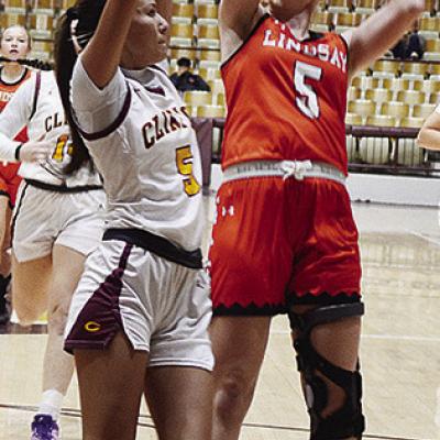 Clinton’s Lillian Lime defends against a Lindsay player during the Lady Reds’ game against the Leopardettes in the Tornado