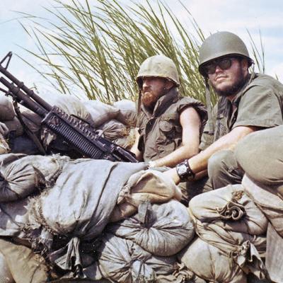 Sam Hendricks, at right, mans his gun during the Vietnam War with his fellow soldier, Louvier.