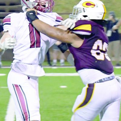 Clinton’s Kong Reeves, right, creates space by blocking Weatherford’s Carter Teasley. CDN | John Kinsey Reach blocked