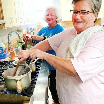 Gal pals help out in church kitchen