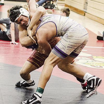 Clinton’s Tyson Brookter, left, grapples with his opponent during the Max Dippel Memorial Wrestling Tournament in Weatherford this season. CDN | Sam Goodwyn
