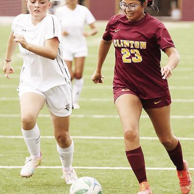 Clinton’s Audrina Trout, right, outraces the Elk City defender during the Lady Reds’ home game against the Elkettes in the Tornado Bowl. CDN | Steve Wheeler