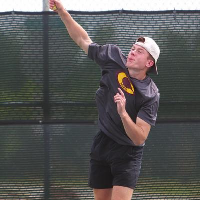 Nate Jones offers up a serve in the boys’ No. 1 doubles finals versus Kingfisher Thursday. Jones and Matt Nguyen took first. CDN | Adam Ewing Clinton tennis hosts Route 66 tourney