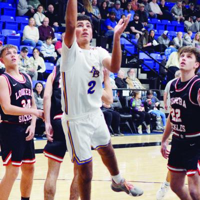 Arapaho-Butler’s Orsan Jubara hits a bucket after going past three Lookeba-Sickles defenders. The Indians compete tonight at home against Calumet in the Coaches vs. Cancer contest. CDN | Staff photo Points in the paint