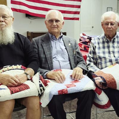 Veterans, from left, Denver Horn, Alfred Miller, and Larry Goeringer were recently presented with Quilts of Valor at Peace Lutheran Church in Bessie. CDN | Courtesy photo