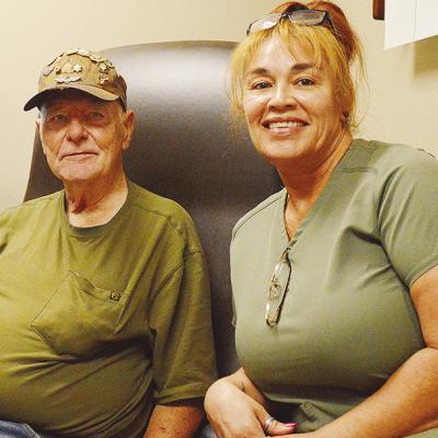Veteran Edward Frye, left, gets an audiology exam with nurse Merry Jacobs at the Clinton VA Clinic. CDN | Micah Ashcraft