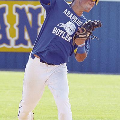 Arapaho-Butler’s Orsan Jubara throws the ball with all of his might to first for the out during the Indians’ game against Clinton. CDN | Sam Goodwyn
