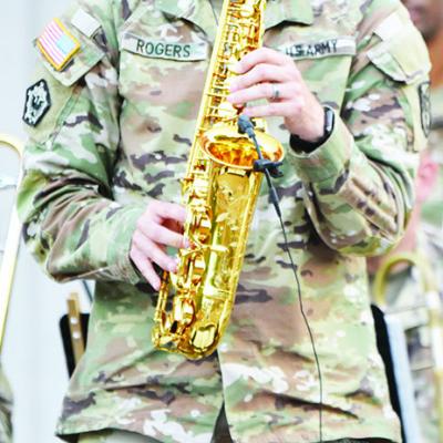 Sgt. Daniel Rogers plays a solo with the 77th Army Band recently at McLain Rogers Park. CDN | Caleb Blanchard Hit it