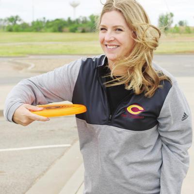 Katie Daugherty throws a flying disc that will be used for the new REDS 365 program. CDN | Emily Stephens Summer, afterschool program REDS 365 to make its debut