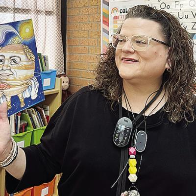 Nance Elementary School teacher Julie Parker reads from a book during class. CDN | Courtesy photo
