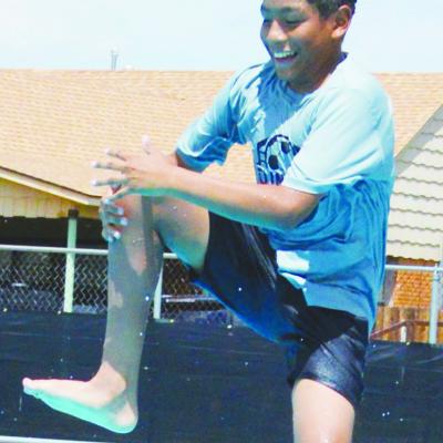Omar Macias aims to do a zipper dive into the Clinton Public Pool. CDN | Christian Jacobsen