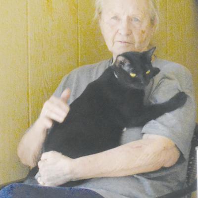 Sue Morries was excited for the photo and went to grab her cat Dalila to pose at Forrest Lane in Clinton. CDN | Christian Jacobsen