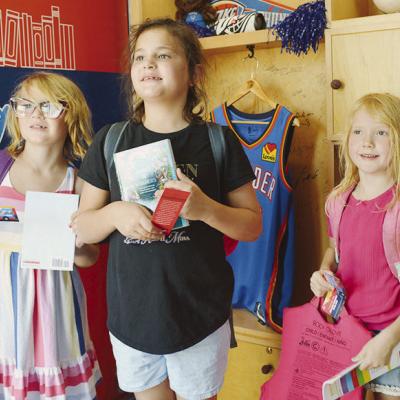 From left, Clara Gregory, Ana Adams, and Emma Armbruster visit the Rolling Thunder Book Bus at the Frisco Center. CDN | Christian Jacobsen From left, Clara Gregory, Ana Adams, and Emma Armbruster visit the Rolling Thunder Book Bus at the Frisco Center. CDN | Christian Jacobsen