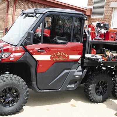 Clinton Fire Department Capt. Blake Shaddon puts a chainsaw away in the recently purchased six-wheeler that can go where bigger vehicles cannot go. CDN | Michael Maresh