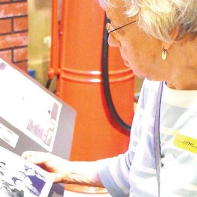 Grace Ramer, of Goshen, Ind., looks through an exhibit booklet inside the Oklahoma Route 66 Musuem in Clinton.