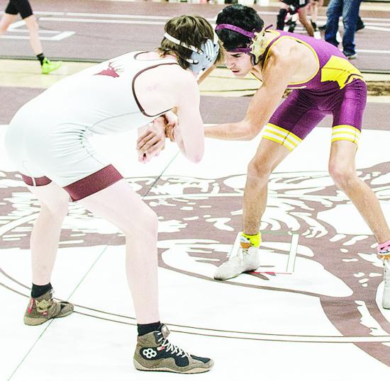 Clinton’s Vicente Gutierrez, right, grapples with his opponent during the District Duals at Elk City. CDN | Sam Goodwyn