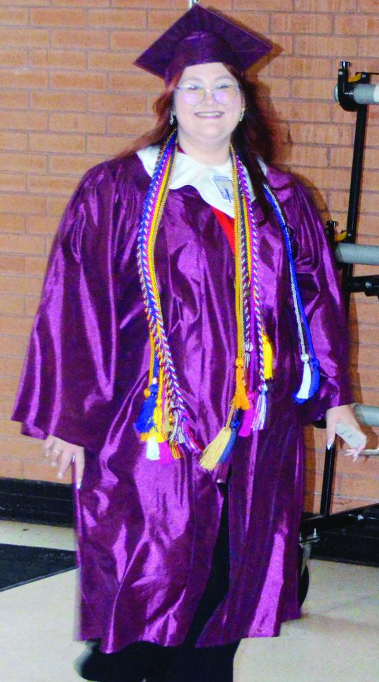Abigail Williams stands excited to have her senior graduation ceremony at the Tornado Dome. CDN | Christian Jacobsen