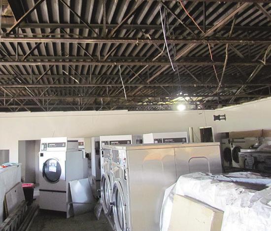 The ceiling stands uncovered and awaits rewiring at the Wash House. CDN | Christian Jacobsen