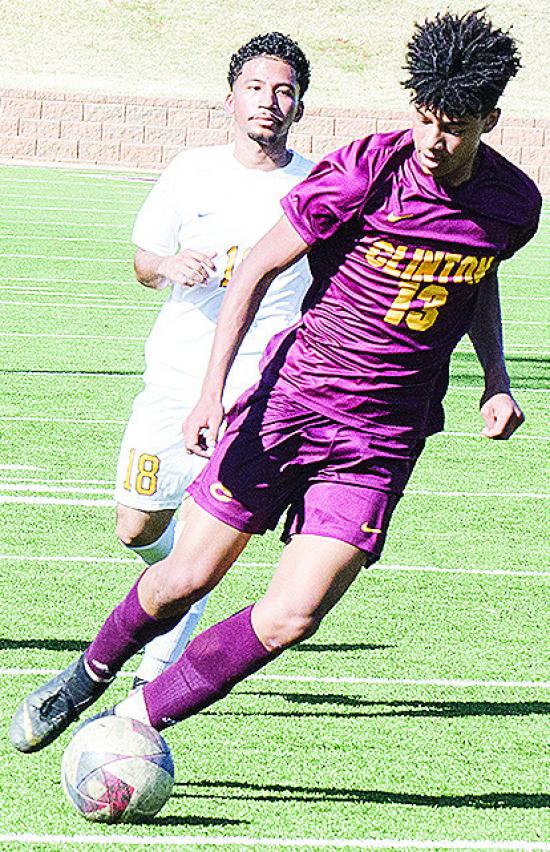 Clinton’s Titan Malone beats the Classen defender to the ball during the Reds’ home game against the Comets. CDN | Sam Goodwyn