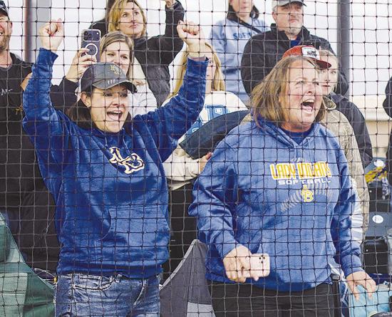 Amber Lee, left, and Kyla Garibay show their excitement following the final out as the Arapaho-Butler Lady Indians slowpitch softball team defeated Caddo 13-2 at the FireLake Ball Fields to capture the title. CDN | Sam Goodwyn