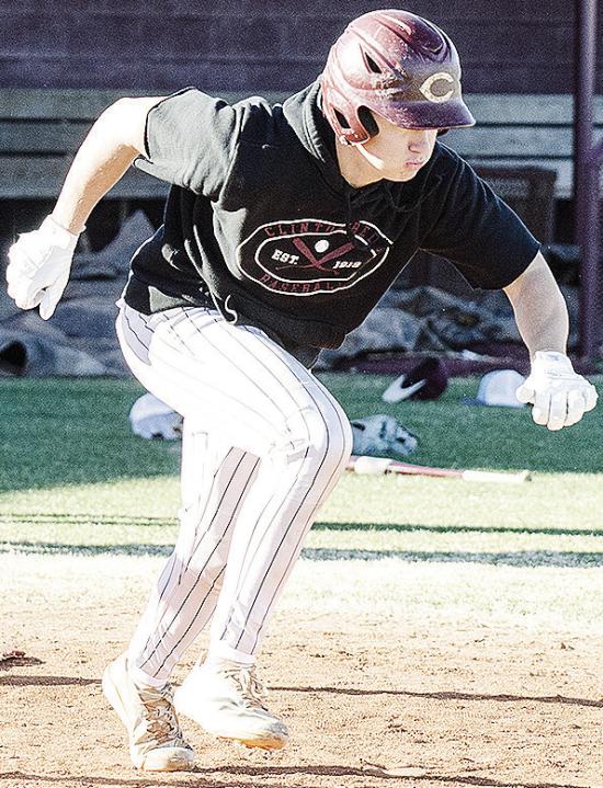 Clinton’s Vince Jones hustles away from home plate to first during a batting drill in baseball practice. CDN | Sam Goodwyn