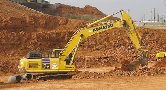 An excavator clears dirt Monday in front of Holiday Inn Express as part of the Exit 65 project. CDN | Christian Jacobsen