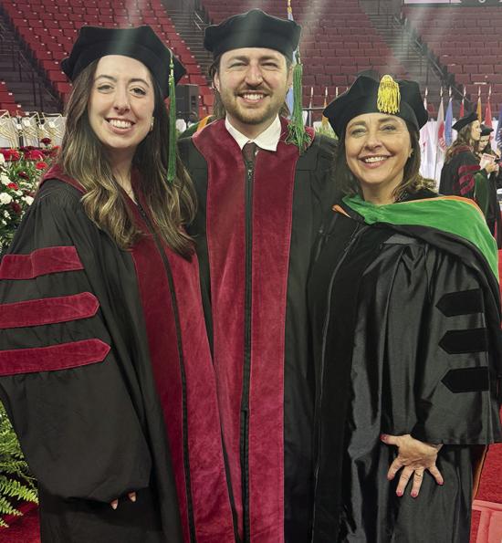 From left, Dr. Laramie Knapp, Dr. Gavin Knapp, and Dr. Stacy Knapp pose during the University of Oklahoma’s recent graduation. Stacy, as a practicing physician and by the tradition of welcoming a new physician to the profession, was able to “hood” h