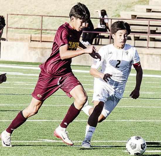 Sergio Solis, left, battles a Woodward defender for the ball during Clinton’s home game Thursday against the Boomers. CDN | Sam Goodwyn Sergio Solis, left, battles a Woodward defender for the ball during Clinton’s home game Thursday against the Boomers. CDN | Sam Goodwyn