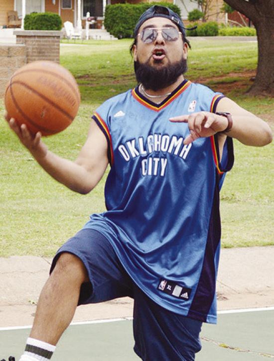 Jonathan Mejia goes up for the basket during two-on-two basketball Tuesday afternoon at the McLain Rogers basketball court. CDN | Christian Jacobson