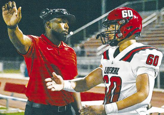 New Clinton offensive and defensive line Randy Powell, left, directs recent Liberal graduate Emilio Sandoval during a game last season. CDN | Courtesy photo