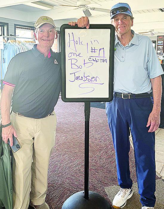 Bob Jacobson, left, smiles with Riverside Golf Pro Perry Adams after hitting a hole-in-one on hole No. 17 at Riverside Golf Course. CDN | Courtesy photo