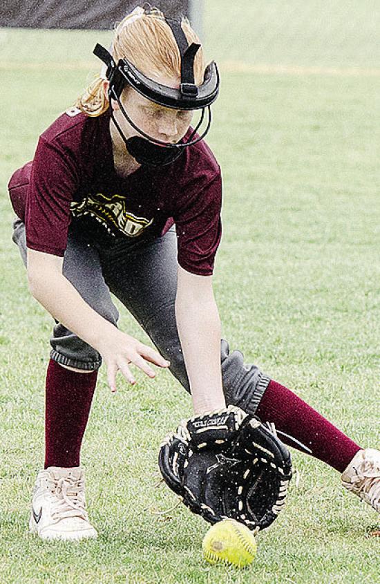 Stella McCarther focuses on the ball as she fields it in the OK Kids 8U Softball State Tournament at Schumacher Fields at Acme Brick Park. CDN |Sam Goodwyn Stella McCarther focuses on the ball as she fields it in the OK Kids 8U Softball State Tournament at Schumacher Fields at Acme Brick Park. CDN |Sam Goodwyn