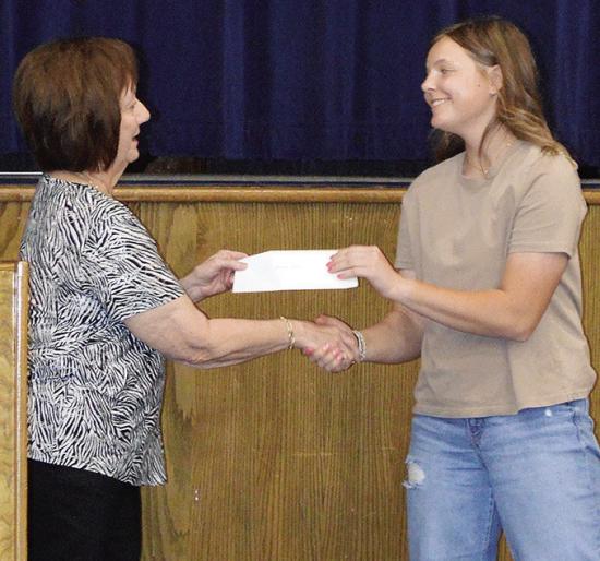 Linda Elston, left, awards the ESA Alpha Nu Scholarship to Malley Baker Wednesday during the Senior Awards Ceremony at the A-B Auditorium. CDN | Christian Jacobsen Linda Elston, left, awards the ESA Alpha Nu Scholarship to Malley Baker Wednesday during the Senior Awards Ceremony at the A-B Auditorium. CDN | Christian Jacobsen