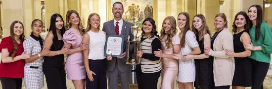 The Clinton dance team was recently honored at the State Capitol for its state title. Pictured, from left, are Coach Payten Childers, Alexandra Fuentes, Danna Mendieta, Stella Meacham, Jocelyn King, Speaker Pro Tempore Anthony Moore, Alexa Soto, Marli Hil