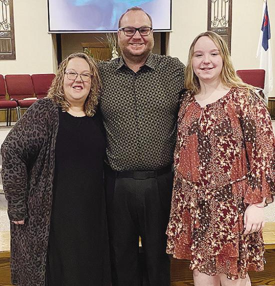 Jamie Patton, center, smiles with his wife Kelli, left, and daughter Carli after being selected as the new pastor at New Hope Fellowship Church. CDN | Courtesy photo Jamie Patton, center, smiles with his wife Kelli, left, and daughter Carli after being selected as the new pastor at New Hope Fellowship Church. CDN | Courtesy photo