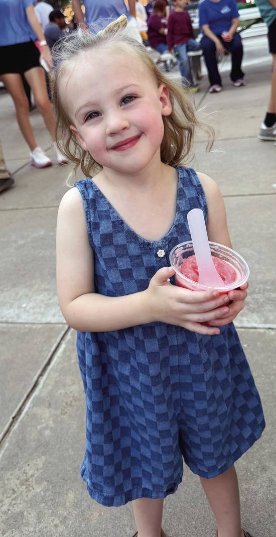 Evie Kliewer enjoys some cool Italian ice recently at the Clinton Farmers Market in Engleman Park. CDN | Courtesy photo