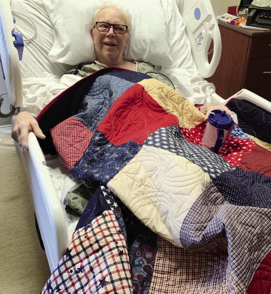 Fred Stehr was scheduled to be presented a Quilt of Valor earlier but was unable to attend the ceremony due to illness. He was presented the quilt recently at the hospital and is seen here beaming with pride. Stehr served in the U.S. Army. The quilt was p