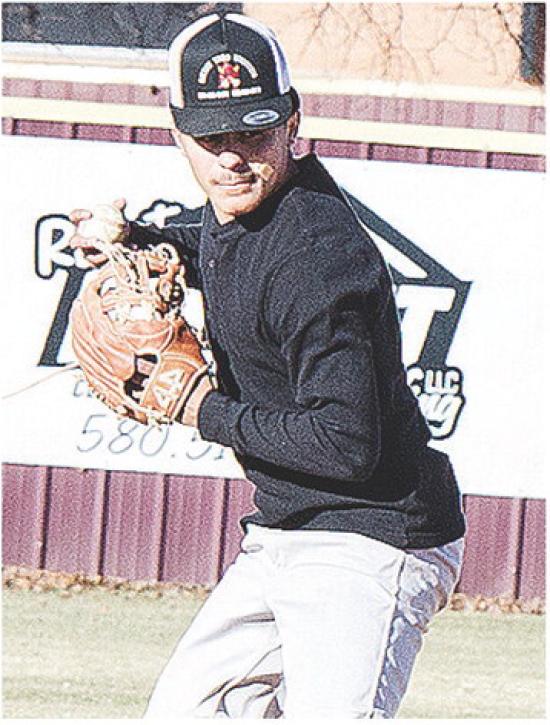 Clinton’s Jesus Gutierrez aims at first base before throwing the ball for an out during practice at the high school baseball field. CDN | Sam Goodwyn
