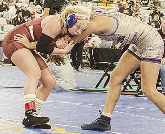 Clinton’s Baylor Moore, left, grapples with her opponent during the consolation semifinals of the Class 5A girls’ wrestling tournament Saturday morning at OG&amp;E Coliseum in Oklahoma City. CDN | Sam Goodwyn